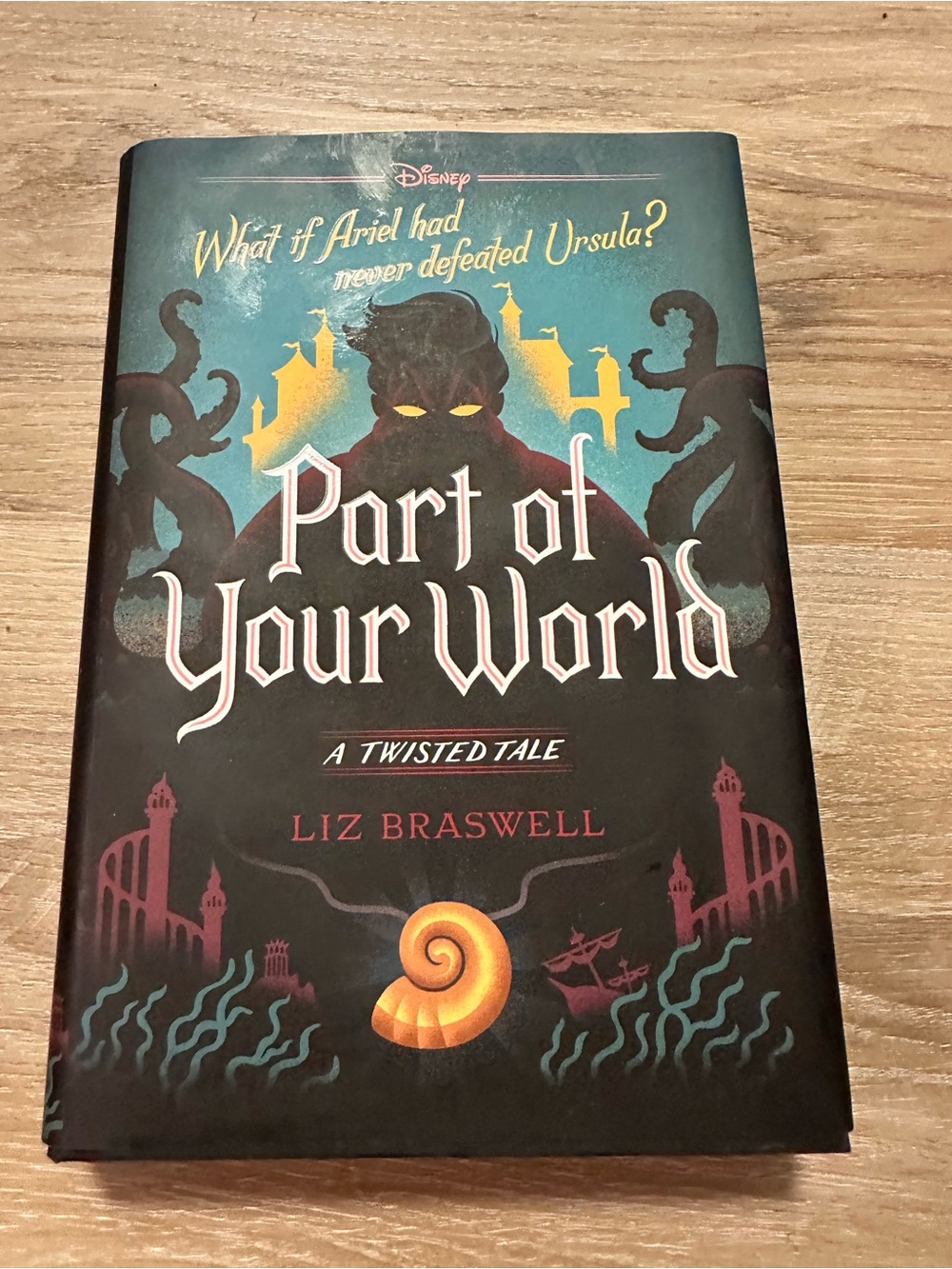 Disney hardcover with black, dark teal, yellow and coral accents